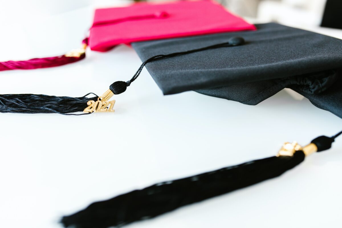 Graduation caps and tassels symbolizing the need to search for alumni.