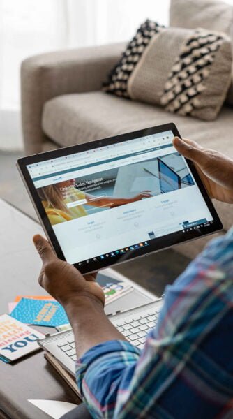 Lead Generation Specialist planning how to get leads on LinkedIn using LinkedIn Sales Navigator on his tablet