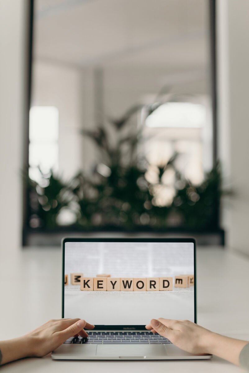 Laptop with keyword message that represents SEO keyword clusters